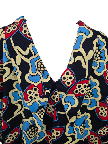 Colorful patterned vest on a mannequin against a neutral background